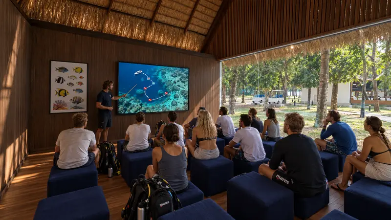 Dive briefing in front of a reef map